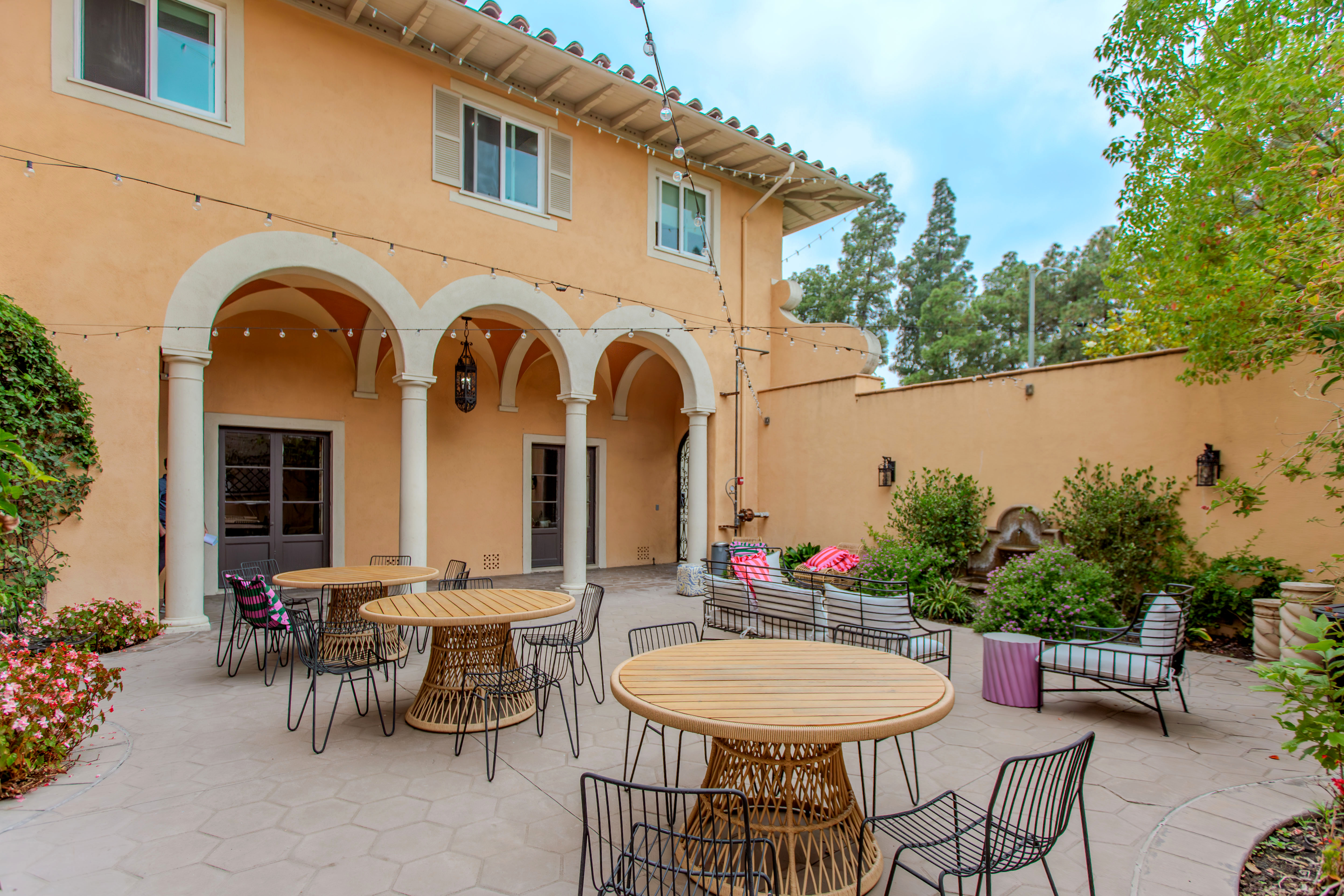 Westholme Park courtyard with arched entry and outdoor seating