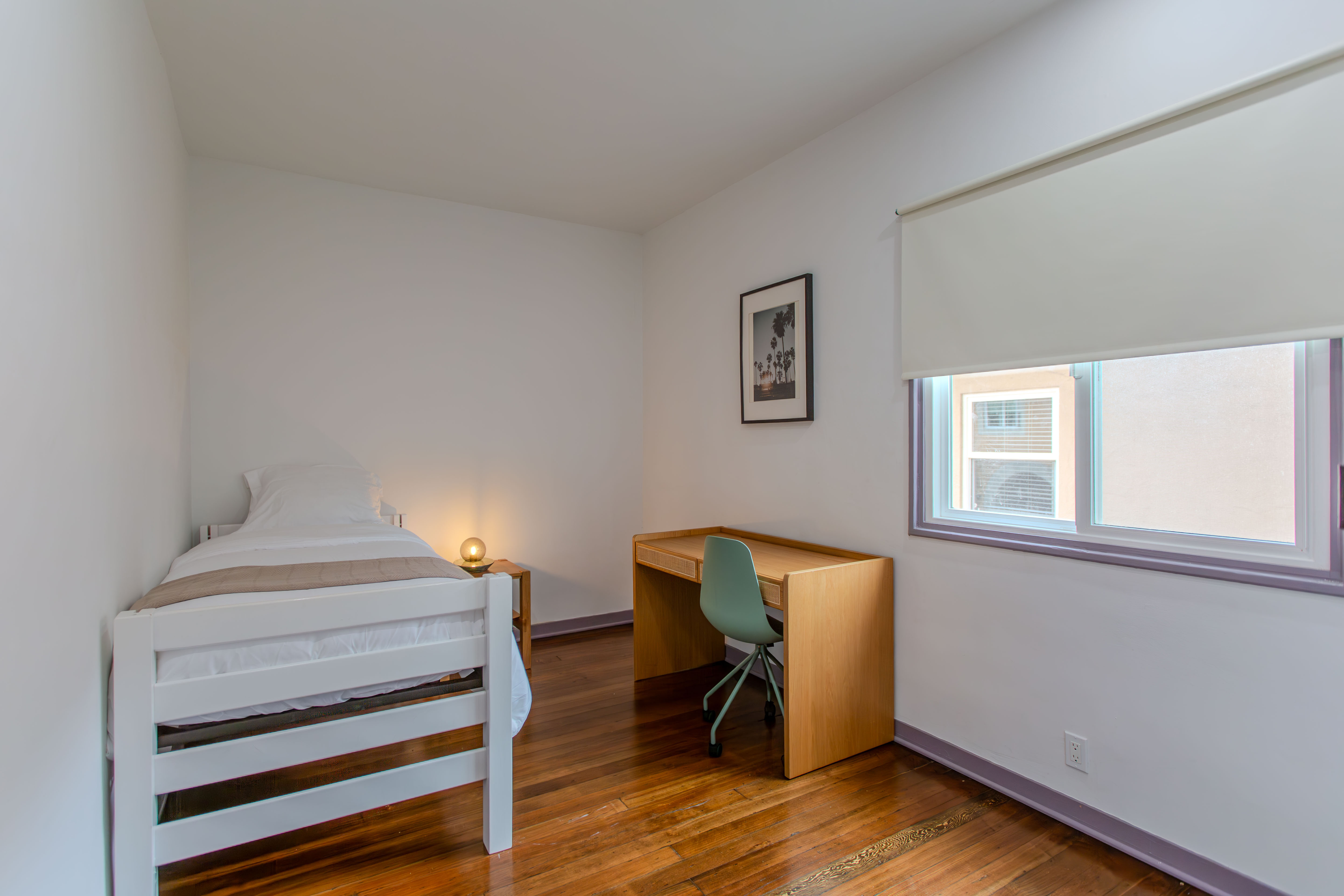 Private bedroom with twin bed and desk